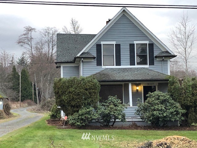 1810 Trigg Road Ferndale, WA 98248 - Photo 2 of 16 a front view of a house with a yard