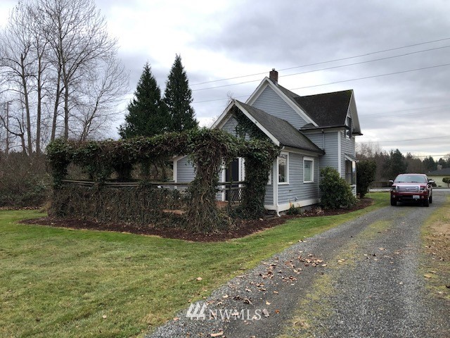 1810 Trigg Road Ferndale, WA 98248 - Photo 4 of 16 a view of a house with a yard