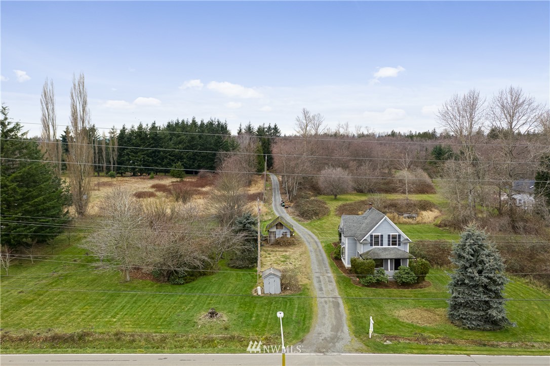 1810 Trigg Road Ferndale, WA 98248 - Photo 9 of 16 a view of a town with mountains in the background