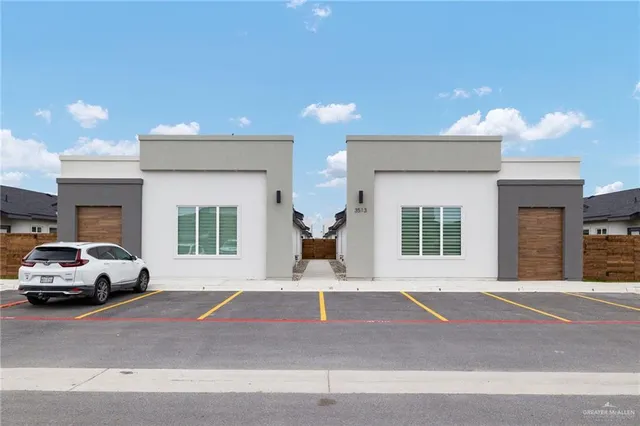 a front view of a house with a garage