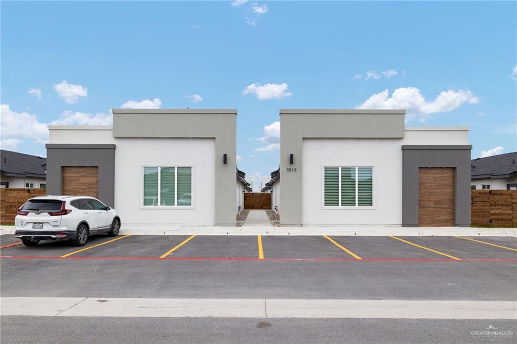 3513 Jessica Lane, Unit 2 Weslaco, TX 78599 - Photo 1 of 12 a front view of a house with a garage