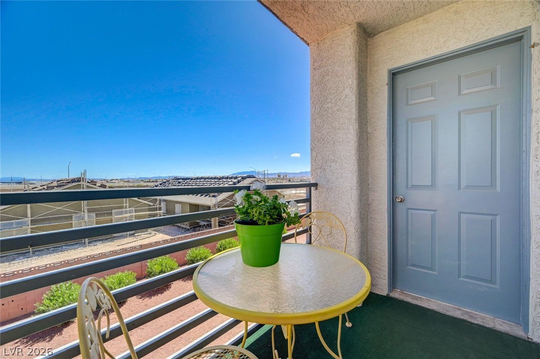 3318 North Decatur Boulevard, Unit 2072 Las Vegas, NV 89130 - Photo 31 of 50 Enjoy scenic mountain and city views from this comfortable private balcony.
