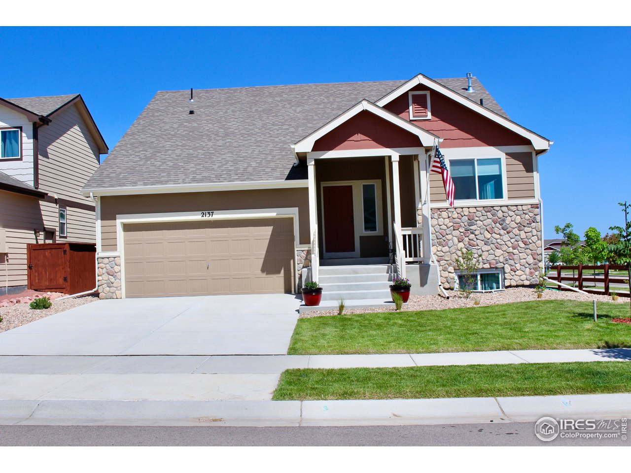 2137 Day Spring Drive Windsor, CO 80550 - Photo 1 of 39 a front view of a house with a yard