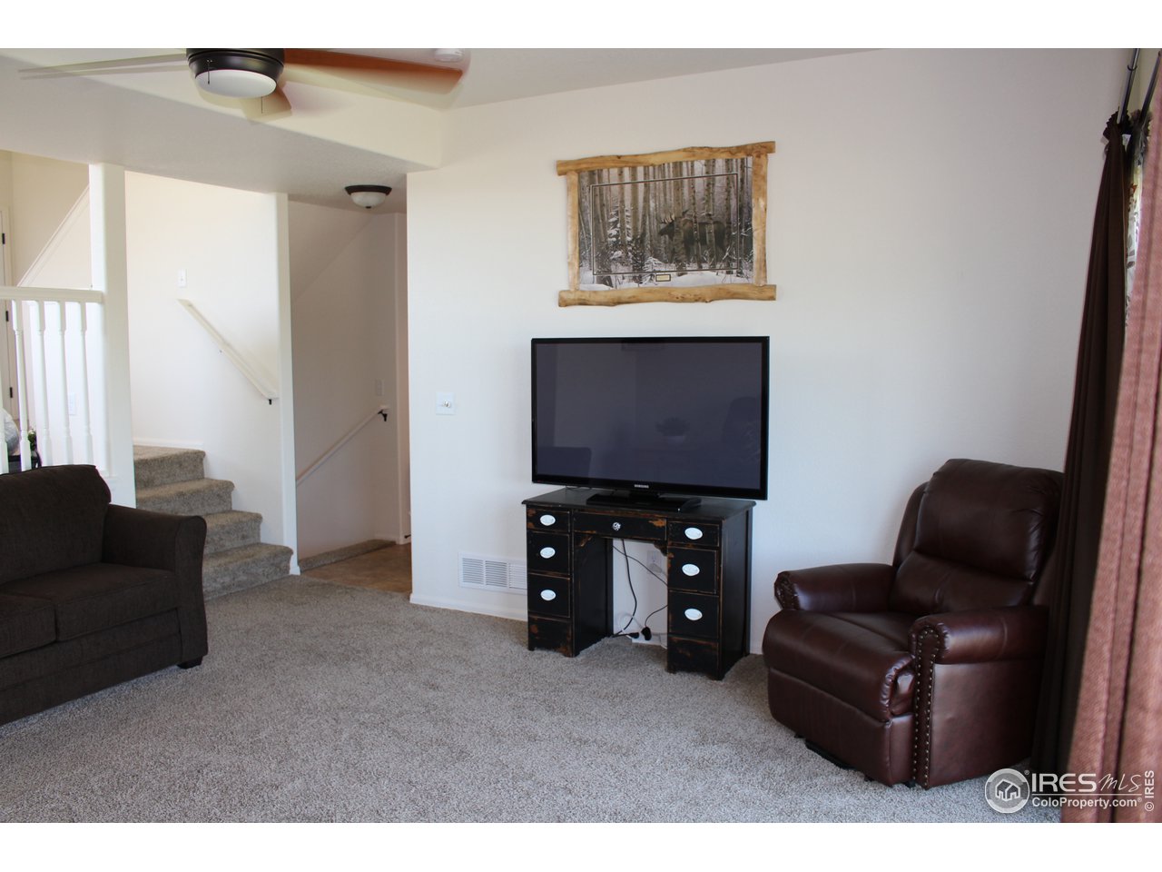 2137 Day Spring Drive Windsor, CO 80550 - Photo 10 of 39 a living room with furniture and a flat screen tv