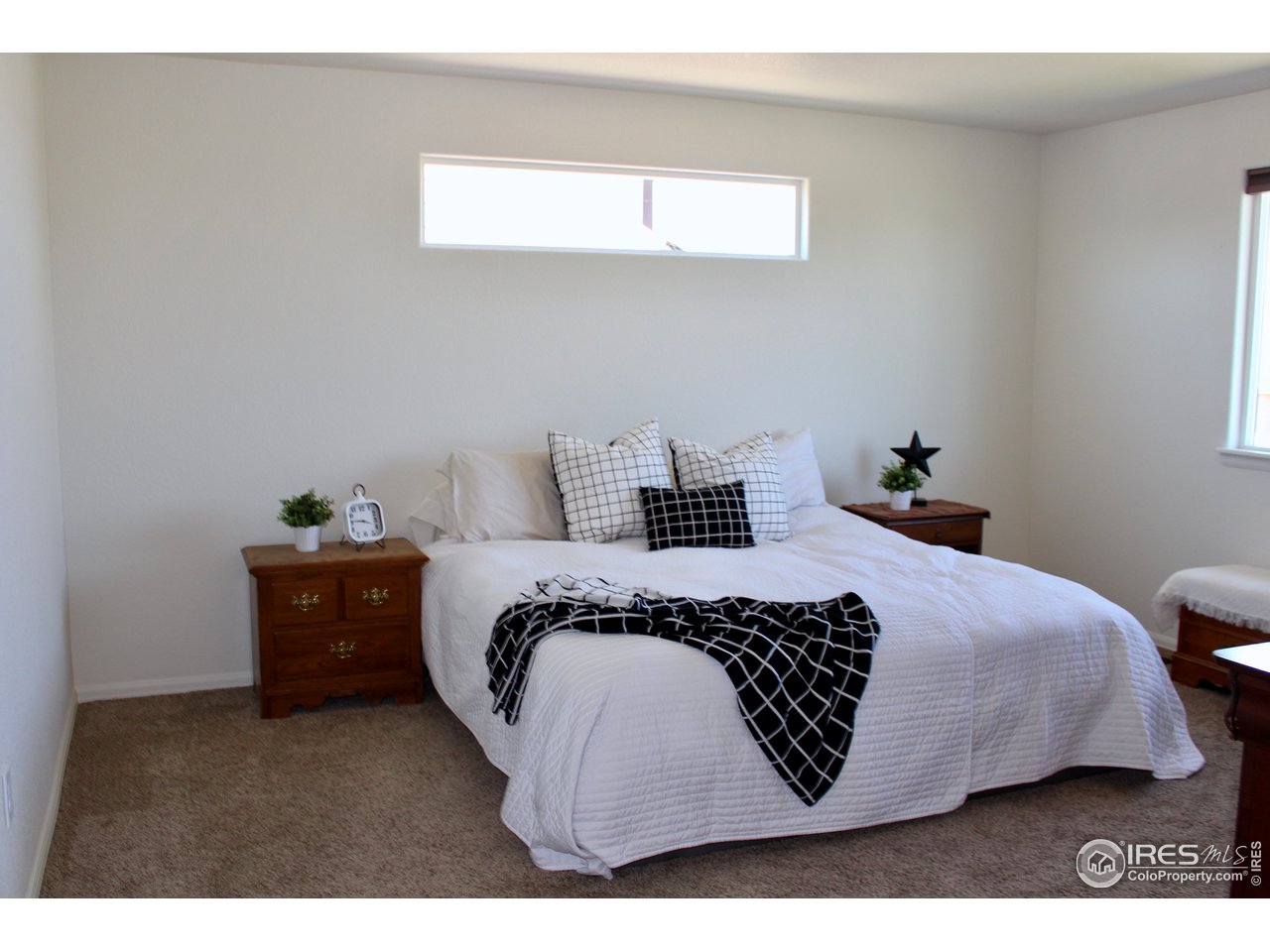2137 Day Spring Drive Windsor, CO 80550 - Photo 12 of 39 a bedroom with a bed and window