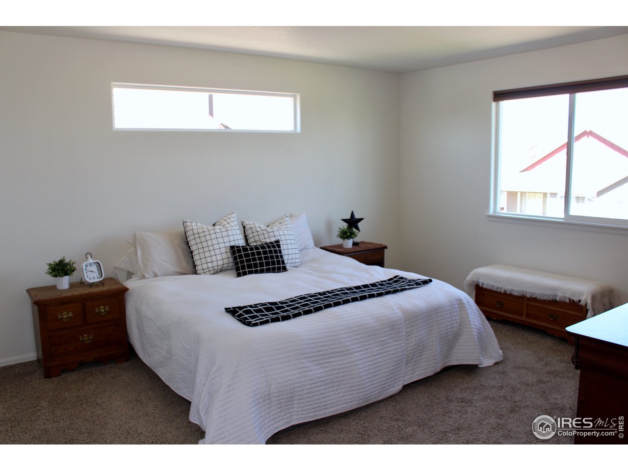 2137 Day Spring Drive Windsor, CO 80550 - Photo 13 of 39 a bedroom with a bed and window
