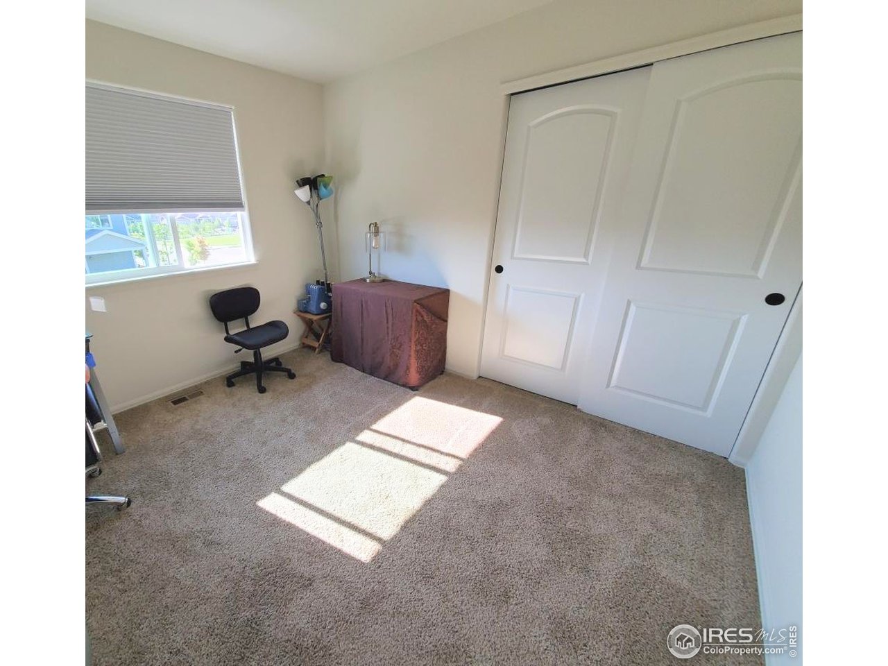 2137 Day Spring Drive Windsor, CO 80550 - Photo 19 of 39 a room with a window and a table