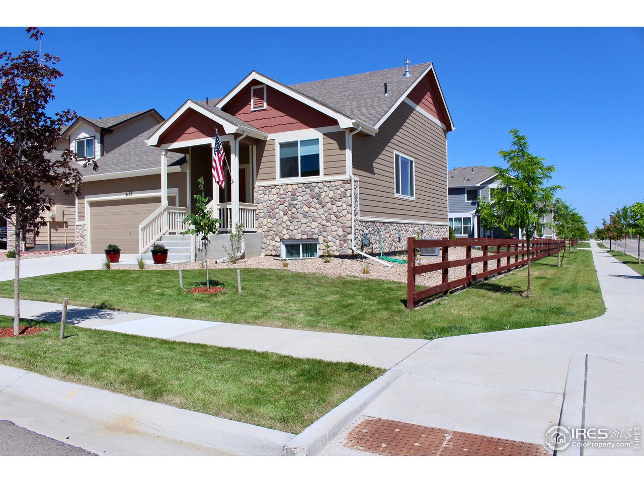 2137 Day Spring Drive Windsor, CO 80550 - Photo 2 of 39 a front view of a house with a yard