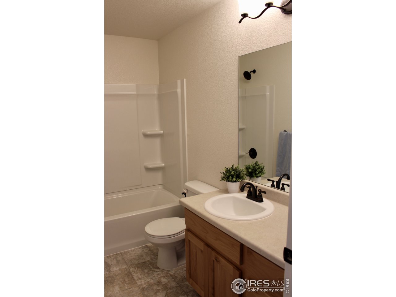 2137 Day Spring Drive Windsor, CO 80550 - Photo 20 of 39 a bathroom with a sink toilet and shower