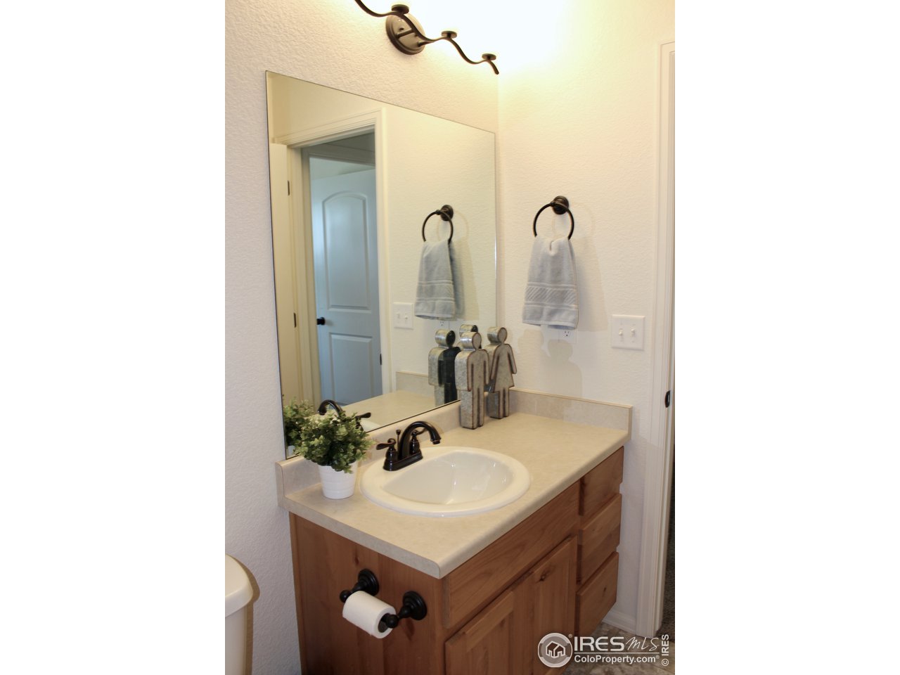 2137 Day Spring Drive Windsor, CO 80550 - Photo 21 of 39 a bathroom with a sink and a mirror