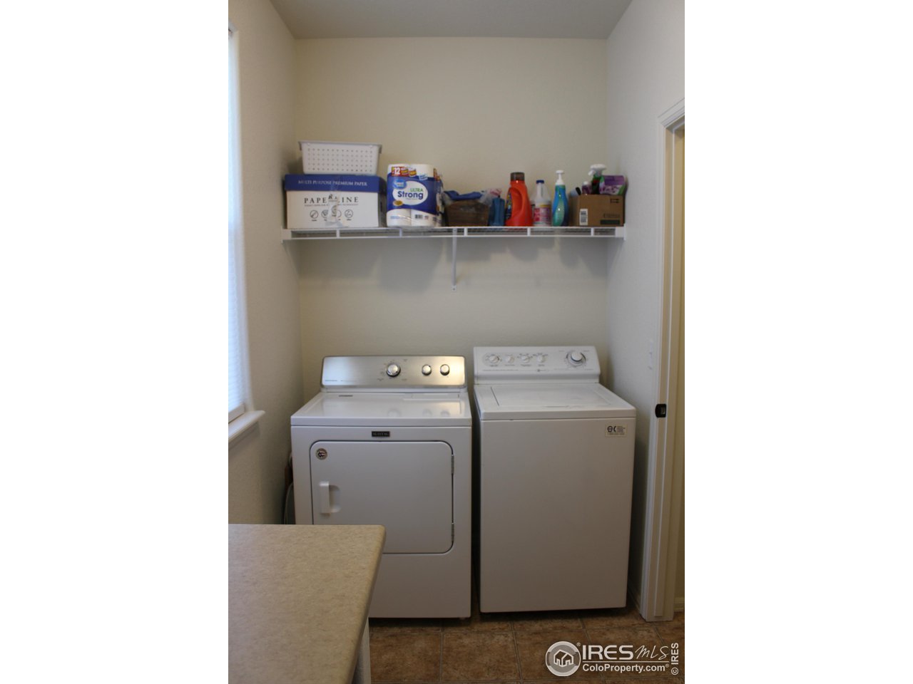 2137 Day Spring Drive Windsor, CO 80550 - Photo 24 of 39 a utility room with dryer and washer