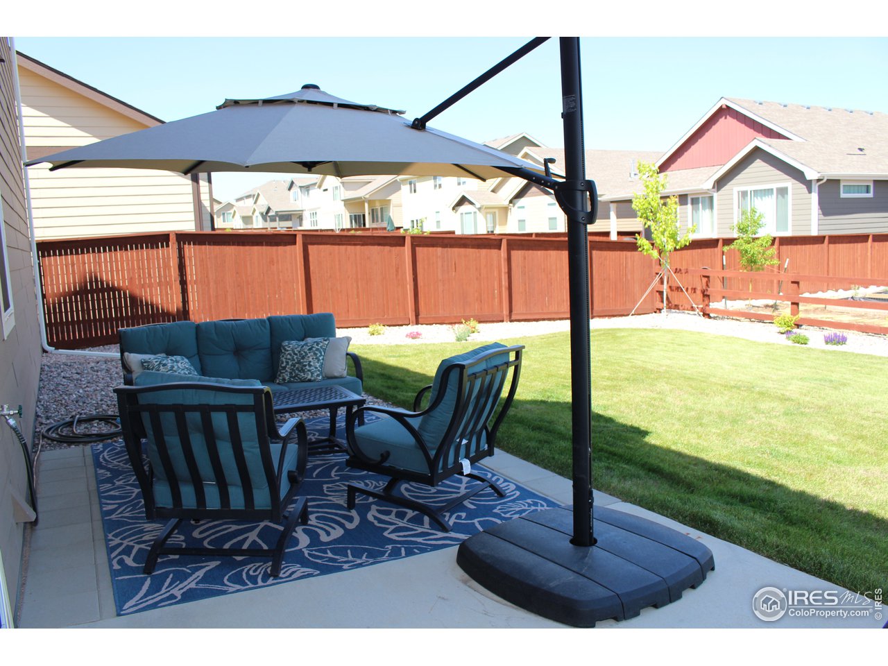 2137 Day Spring Drive Windsor, CO 80550 - Photo 31 of 39 a view of a swimming pool with a table and chairs