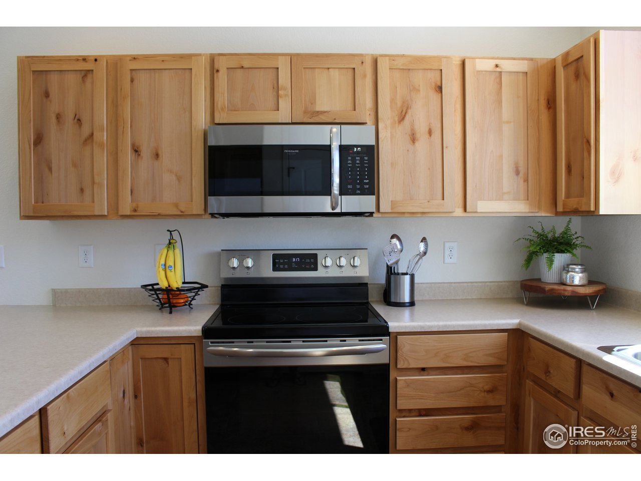 2137 Day Spring Drive Windsor, CO 80550 - Photo 4 of 39 a kitchen with a cabinets and appliances