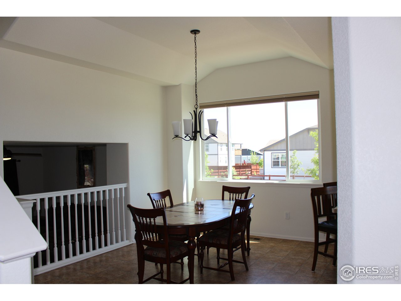 2137 Day Spring Drive Windsor, CO 80550 - Photo 6 of 39 a view of a dining room with furniture window and outside view