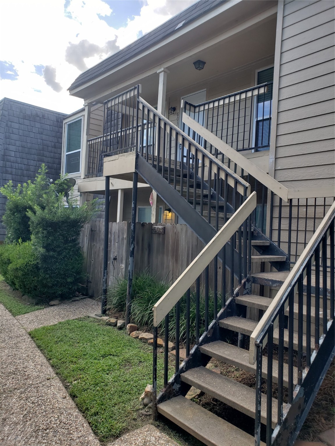 a view of backyard with deck and wooden floor