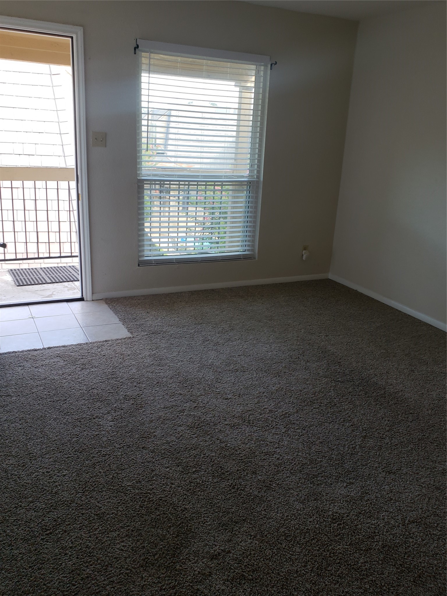 16120 Stuebner Airline Road, Unit 603 Spring, TX 77379 - Photo 10 of 10 an empty room with a empty space and windows