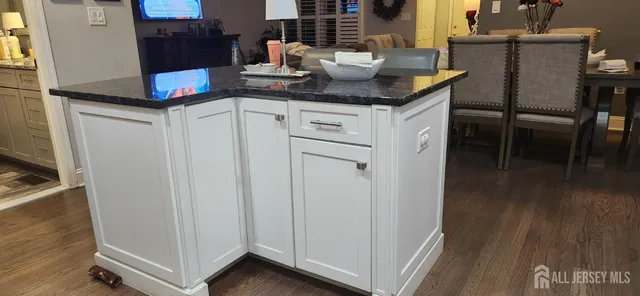 a kitchen with a table chairs and a counter top space