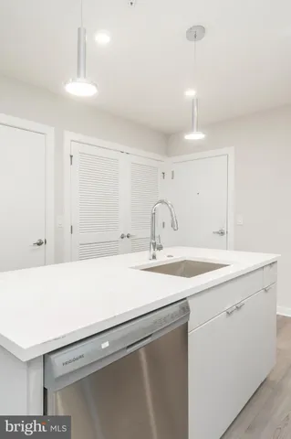 a room with a sink and a mirror