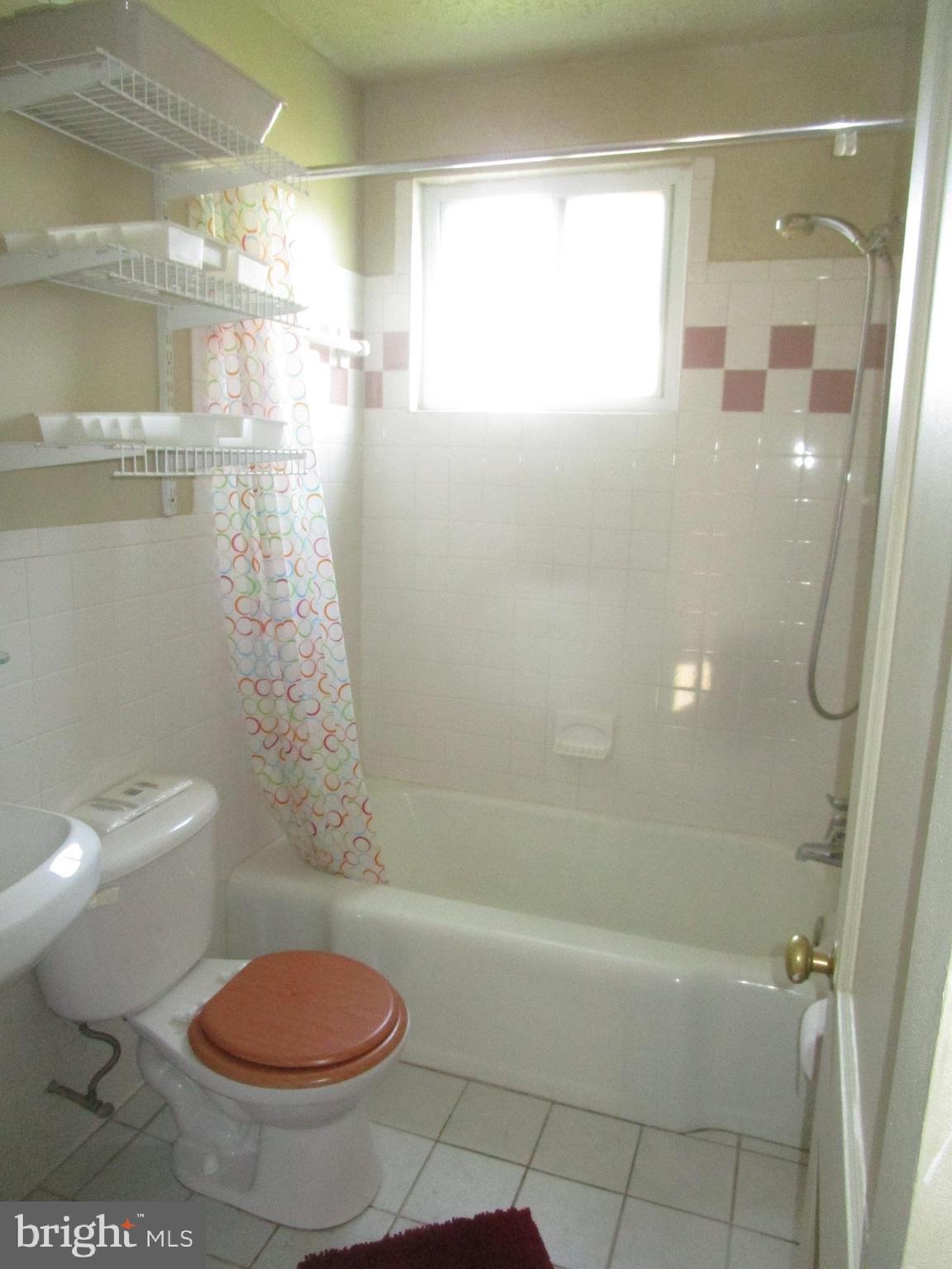 2816 Keating Street, Unit 164 Temple Hills, MD 20748 - Photo 11 of 25 a bathroom with a shower and a toilet