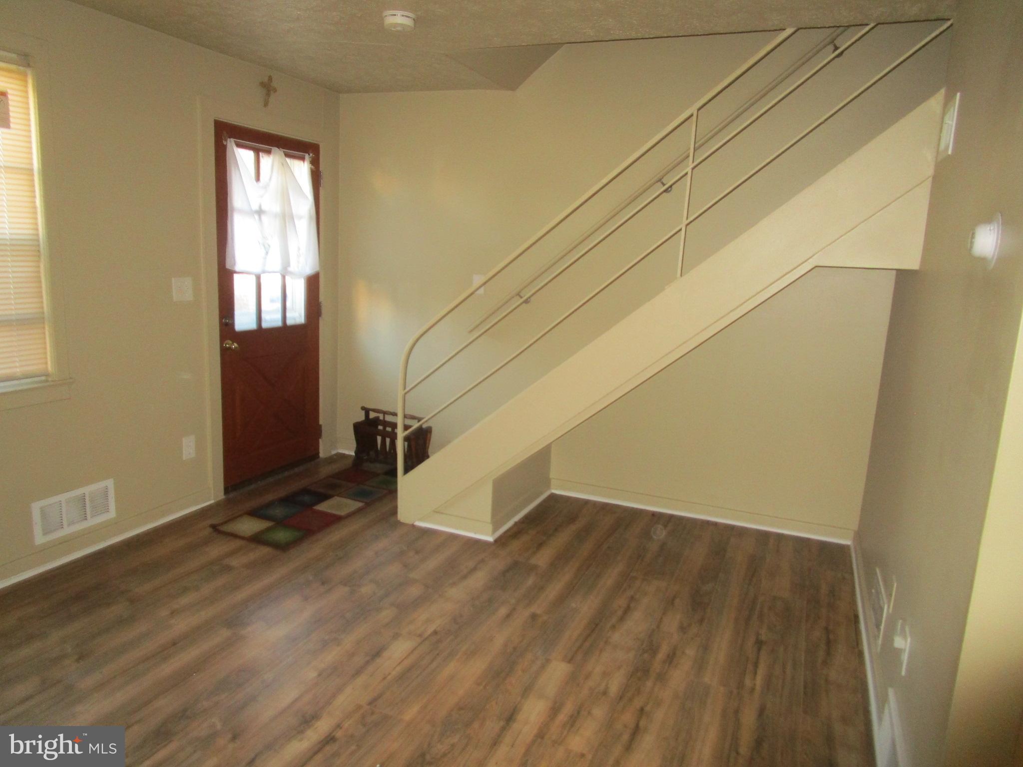 2816 Keating Street, Unit 164 Temple Hills, MD 20748 - Photo 15 of 25 an empty room with wooden floor and windows
