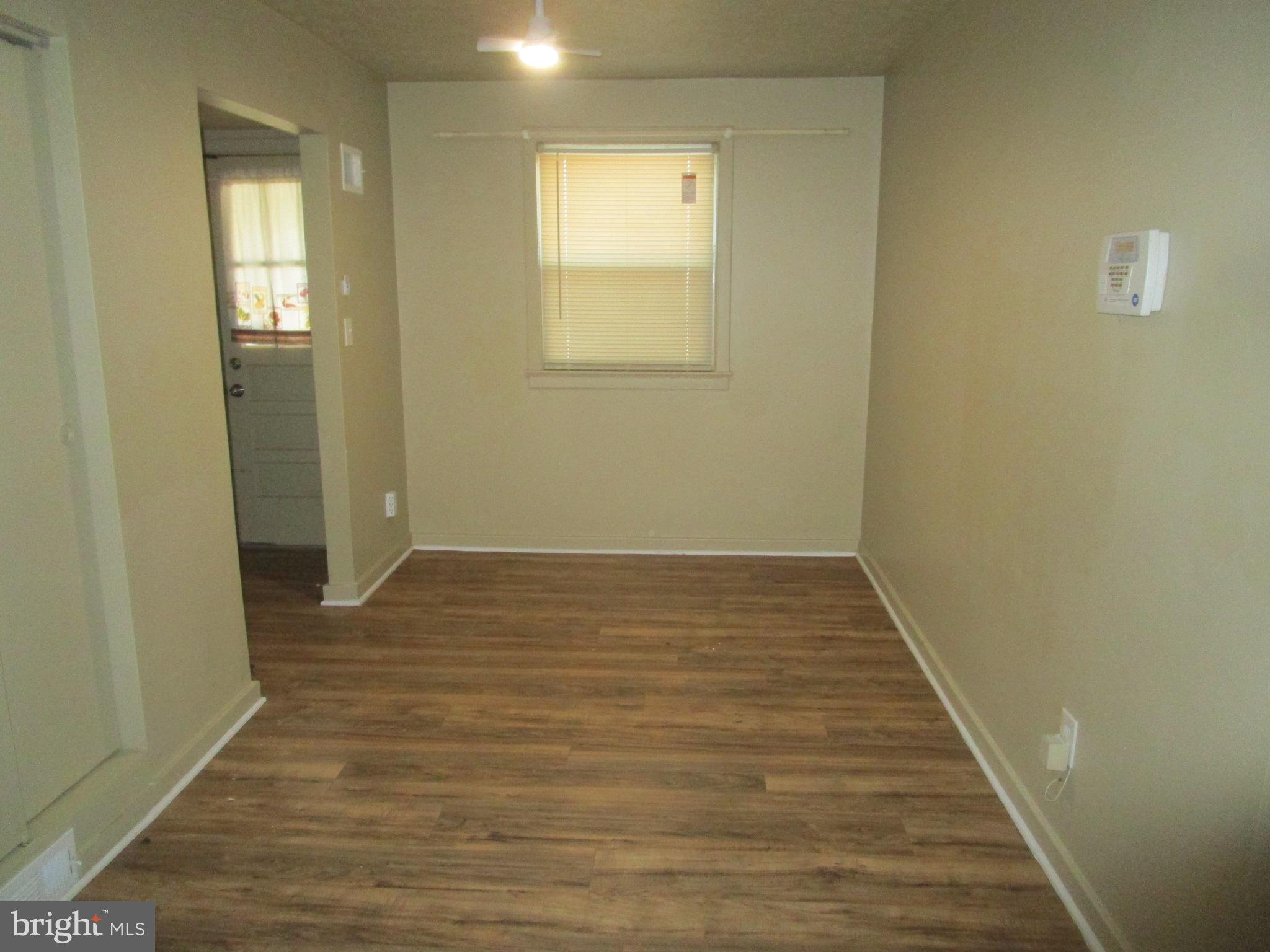2816 Keating Street, Unit 164 Temple Hills, MD 20748 - Photo 16 of 25 a view of a room with wooden floor and windows