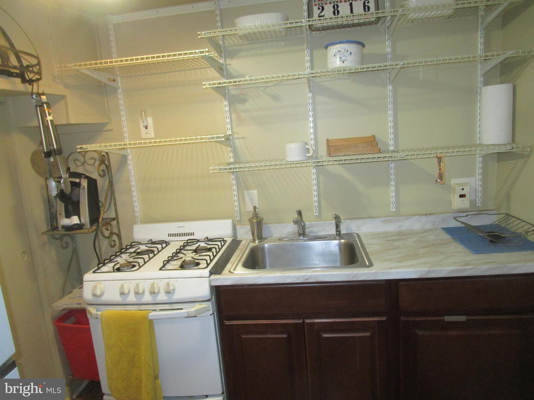 2816 Keating Street, Unit 164 Temple Hills, MD 20748 - Photo 19 of 25 a bathroom with a sink and a washing machine
