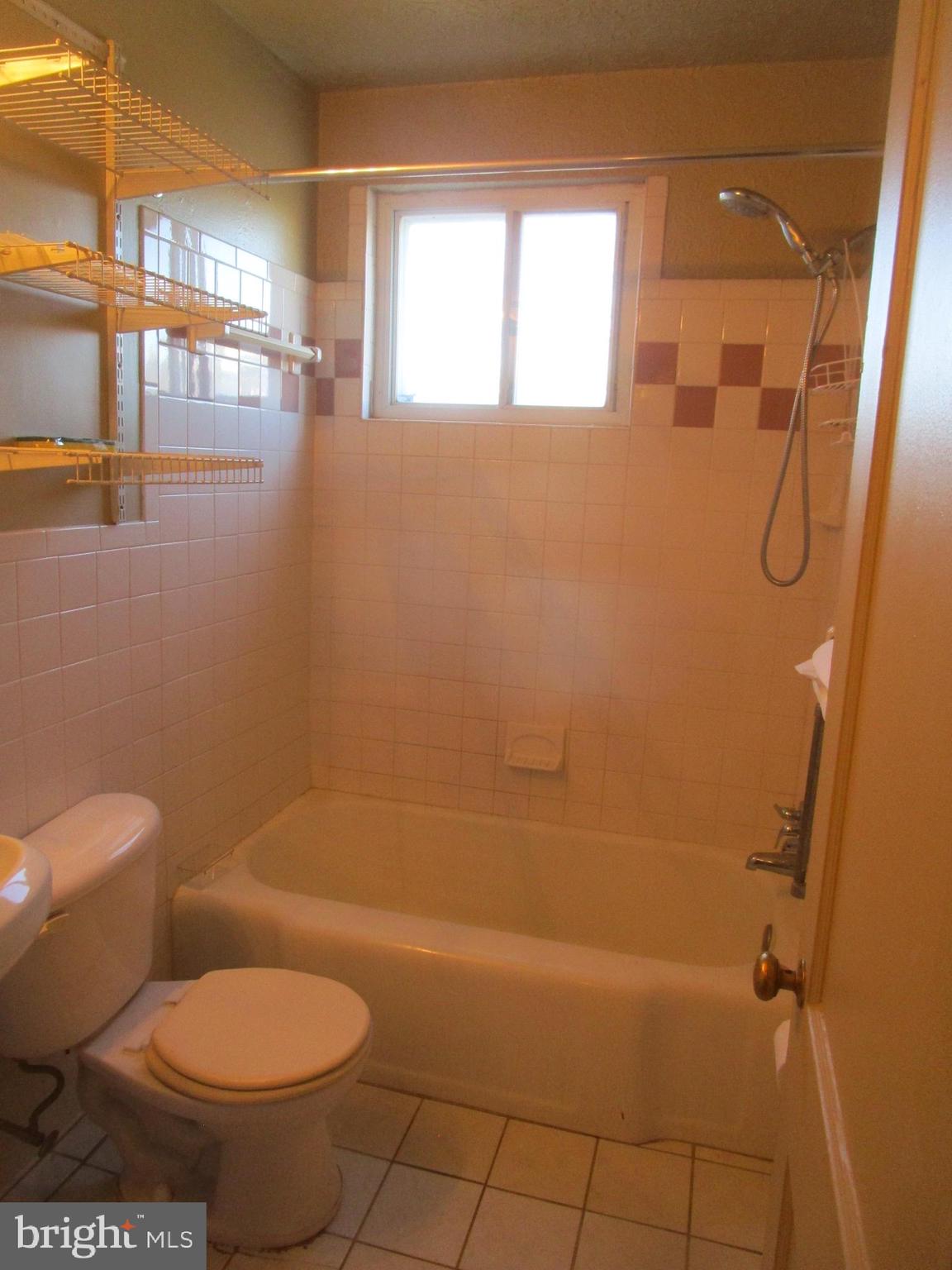 2816 Keating Street, Unit 164 Temple Hills, MD 20748 - Photo 22 of 25 a bathroom with a toilet and a shower