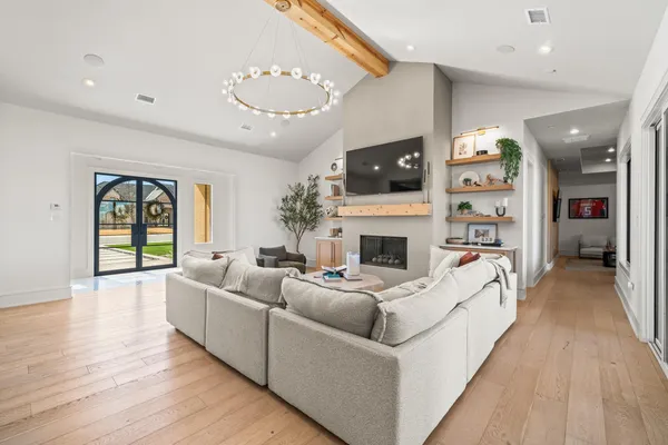 a kitchen with a stove and white cabinets