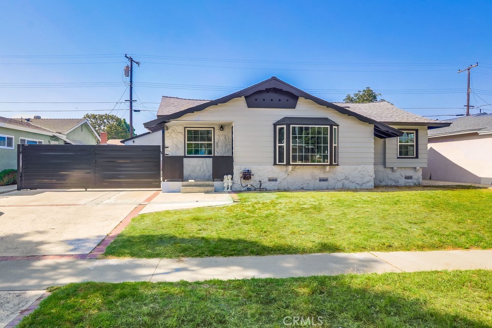 1260 East Turin Avenue, Unit B Anaheim, CA 92805 - Photo 14 of 14 a front view of house with yard and outdoor seating