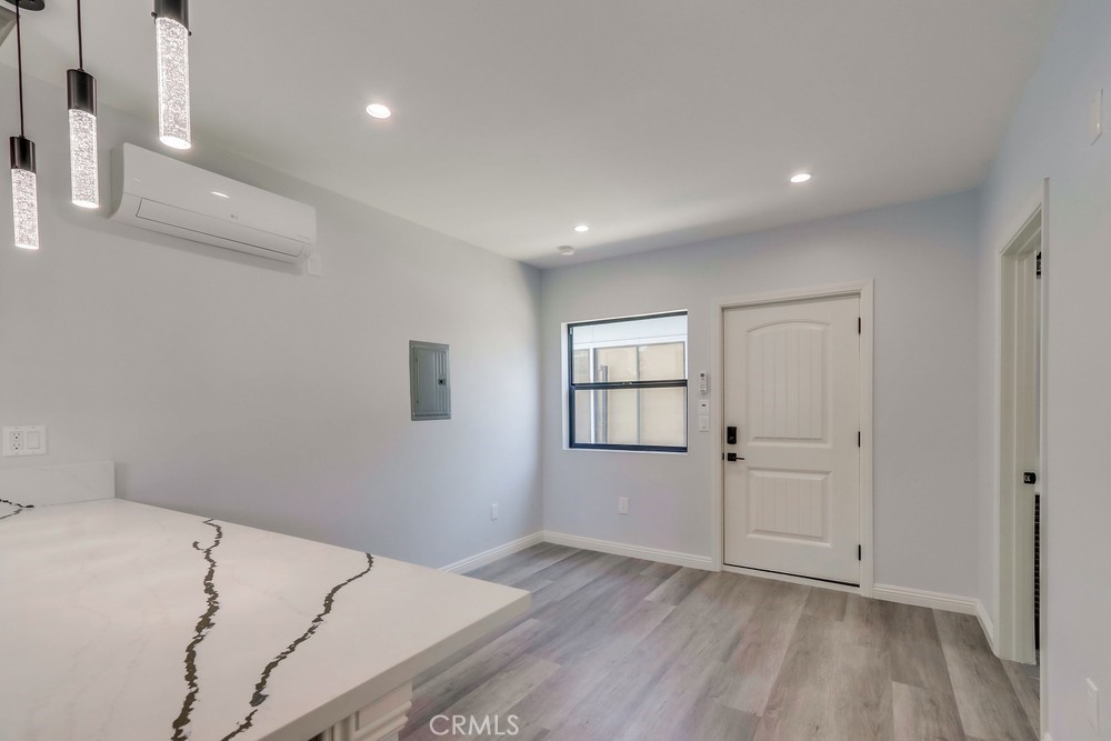 1260 East Turin Avenue, Unit B Anaheim, CA 92805 - Photo 7 of 14 a view of empty room with wooden floor and fan
