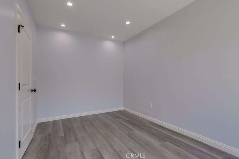 1260 East Turin Avenue, Unit B Anaheim, CA 92805 - Photo 9 of 14 a view of room with wooden floor