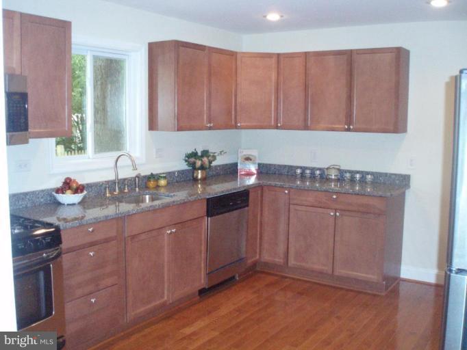 900 Laredo Road Silver Spring, MD 20901 - Photo 4 of 10 a kitchen with a sink and cabinets