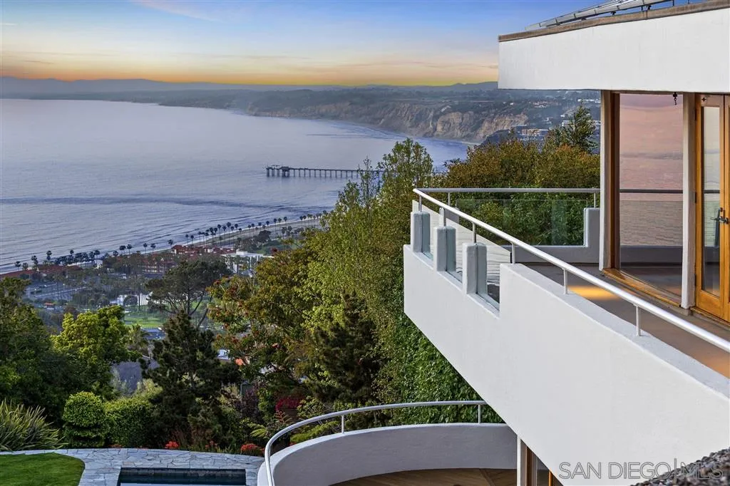 a view of a balcony with an ocean view