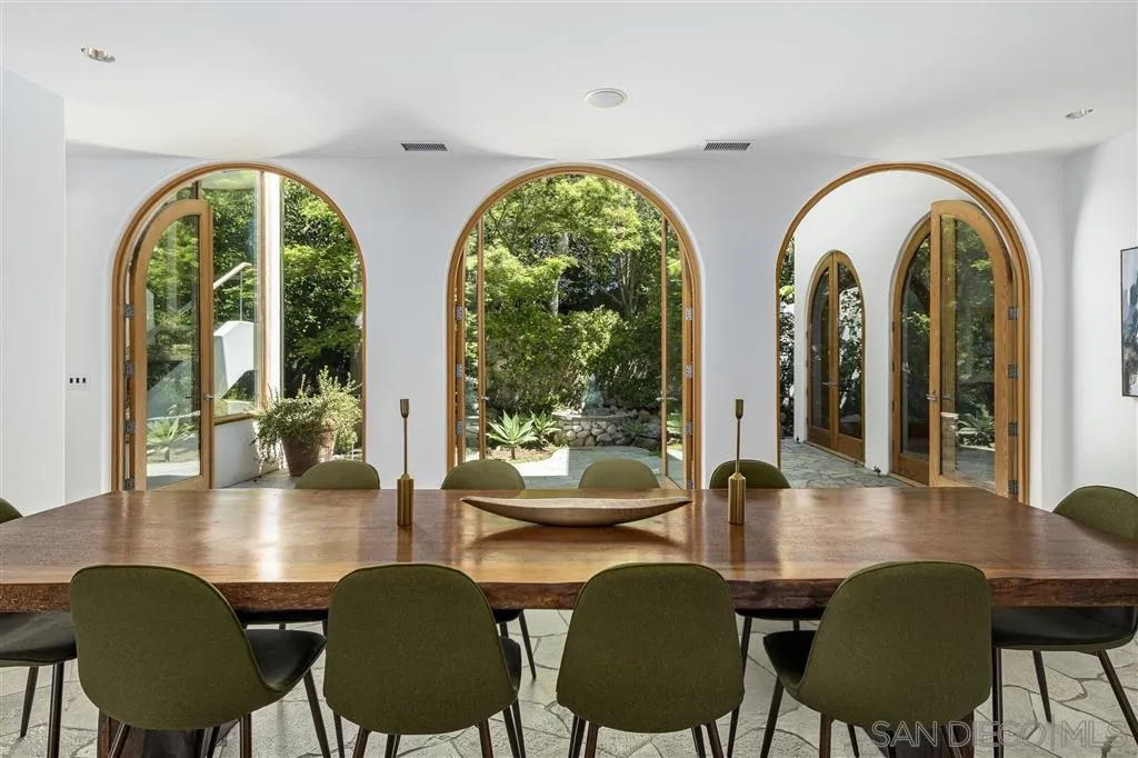 7510 Hillside Drive La Jolla, CA 92037 - Photo 12 of 25 a view of a dining room with furniture and wooden floor