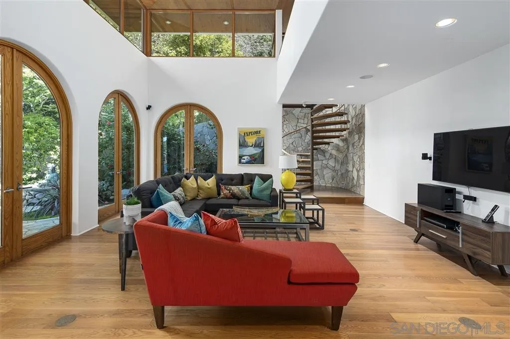 7510 Hillside Drive La Jolla, CA 92037 - Photo 15 of 25 a living room with furniture fireplace and flat screen tv