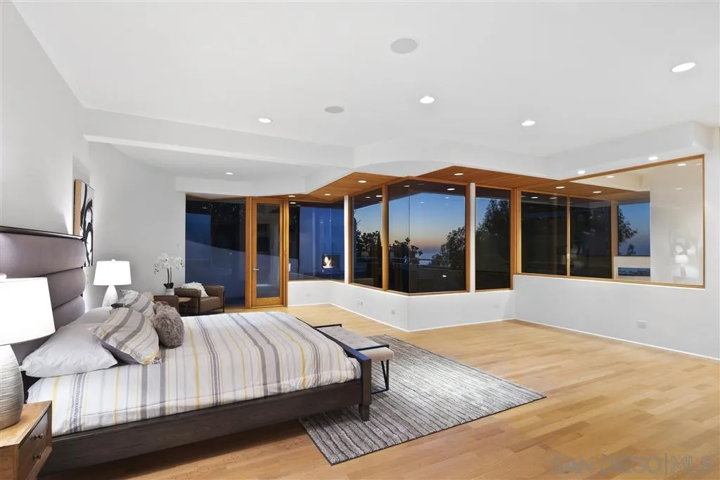 7510 Hillside Drive La Jolla, CA 92037 - Photo 17 of 25 a bedroom with a large bed and a large window