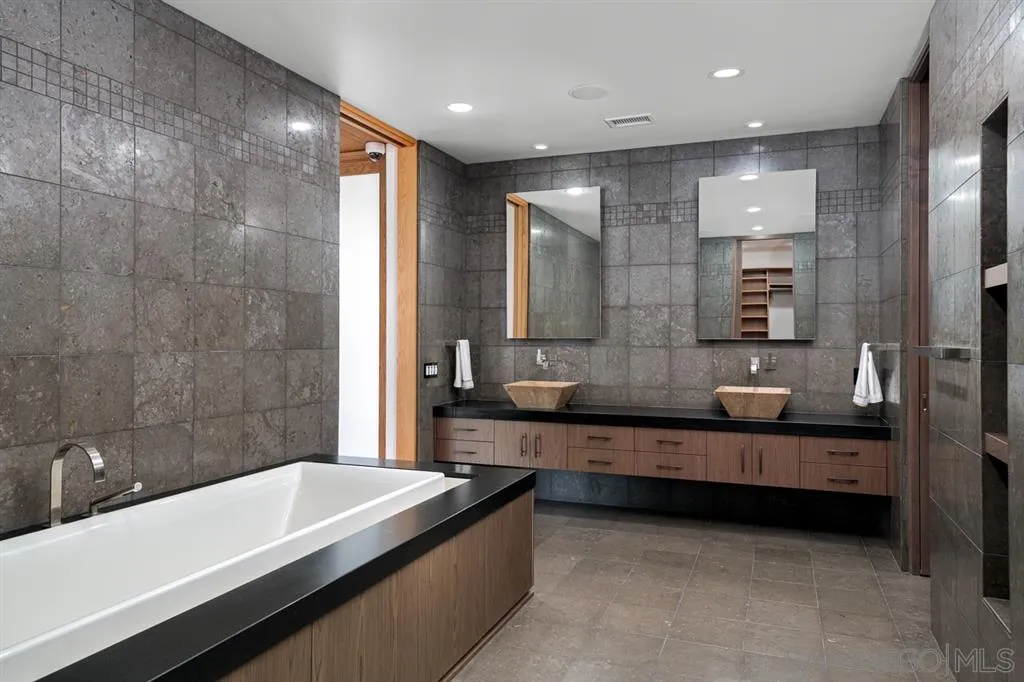 7510 Hillside Drive La Jolla, CA 92037 - Photo 19 of 25 a bathroom with a large tub and double vanity