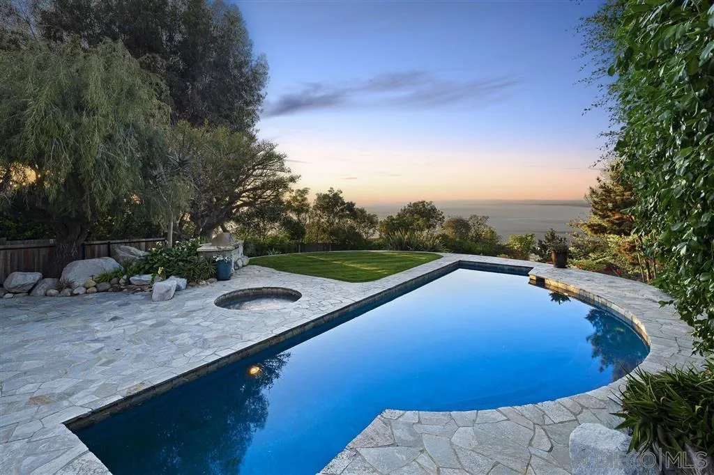 7510 Hillside Drive La Jolla, CA 92037 - Photo 23 of 25 a view of a swimming pool with a yard