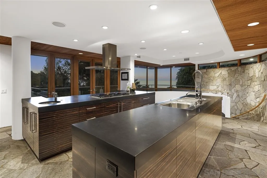 7510 Hillside Drive La Jolla, CA 92037 - Photo 8 of 25 a large kitchen with stainless steel appliances a large counter top