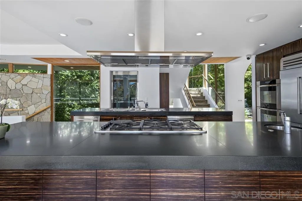 7510 Hillside Drive La Jolla, CA 92037 - Photo 10 of 25 a large kitchen with stainless steel appliances granite countertop a large window