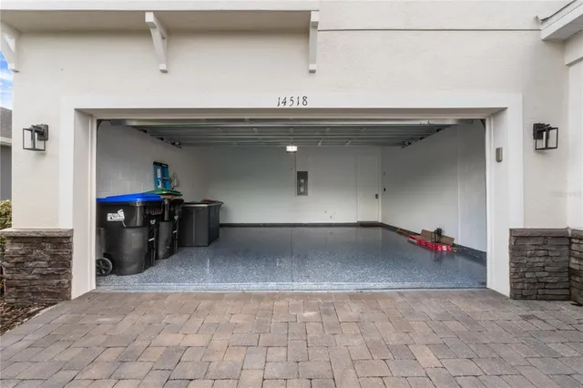 a view of a garden with a building in the background