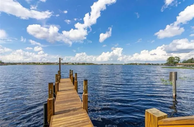 a view of a yard with furniture and outdoor tub