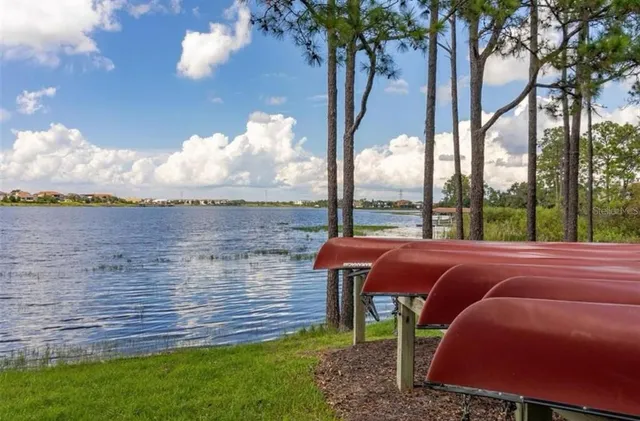 an aerial view of house with yard swimming pool and outdoor seating