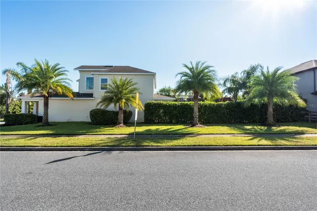 a view of a house with a yard and a large window