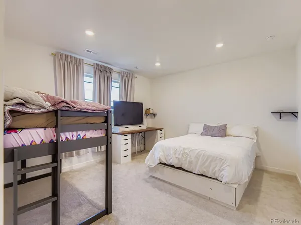a bedroom with a bed and two night stand