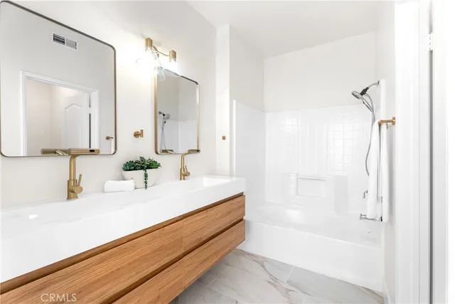a bathroom with a bathtub and a sink