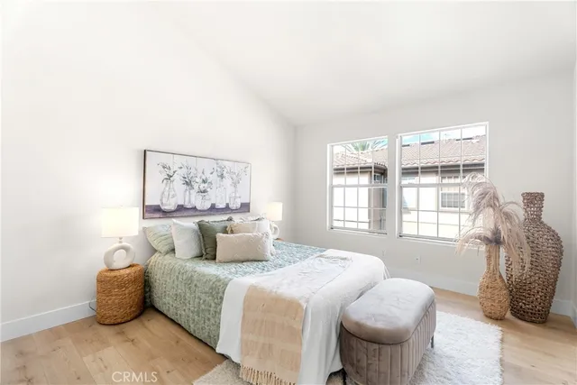 a bedroom with furniture and a window