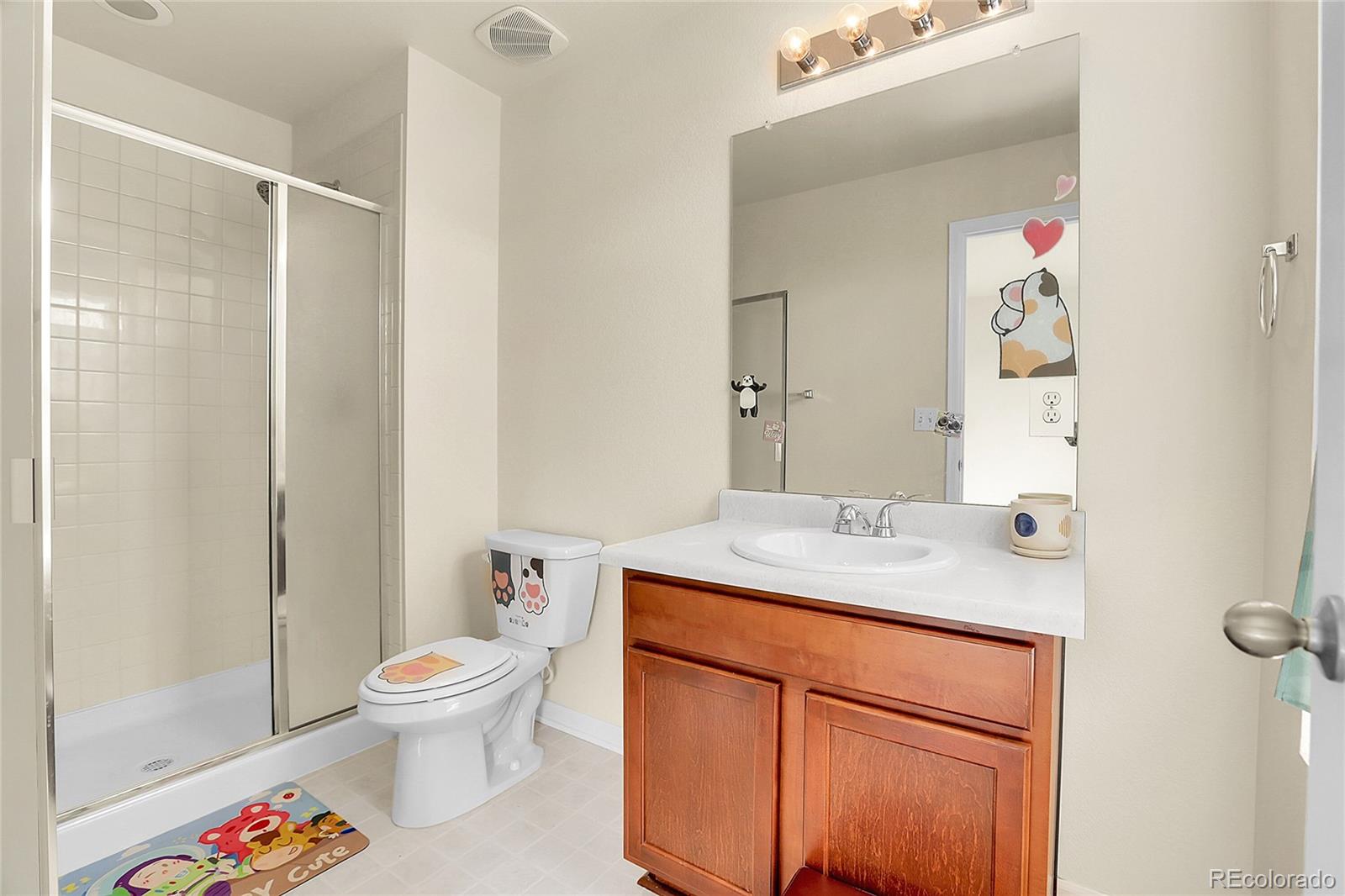3310 Quicksilver Road Frederick, CO 80516 - Photo 13 of 35 a bathroom with a granite countertop sink and a mirror