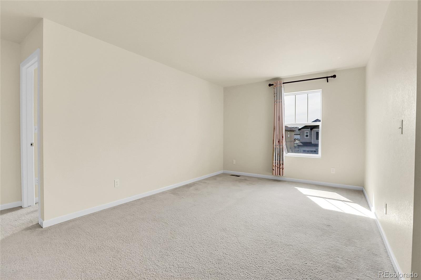 3310 Quicksilver Road Frederick, CO 80516 - Photo 14 of 35 an empty room with windows