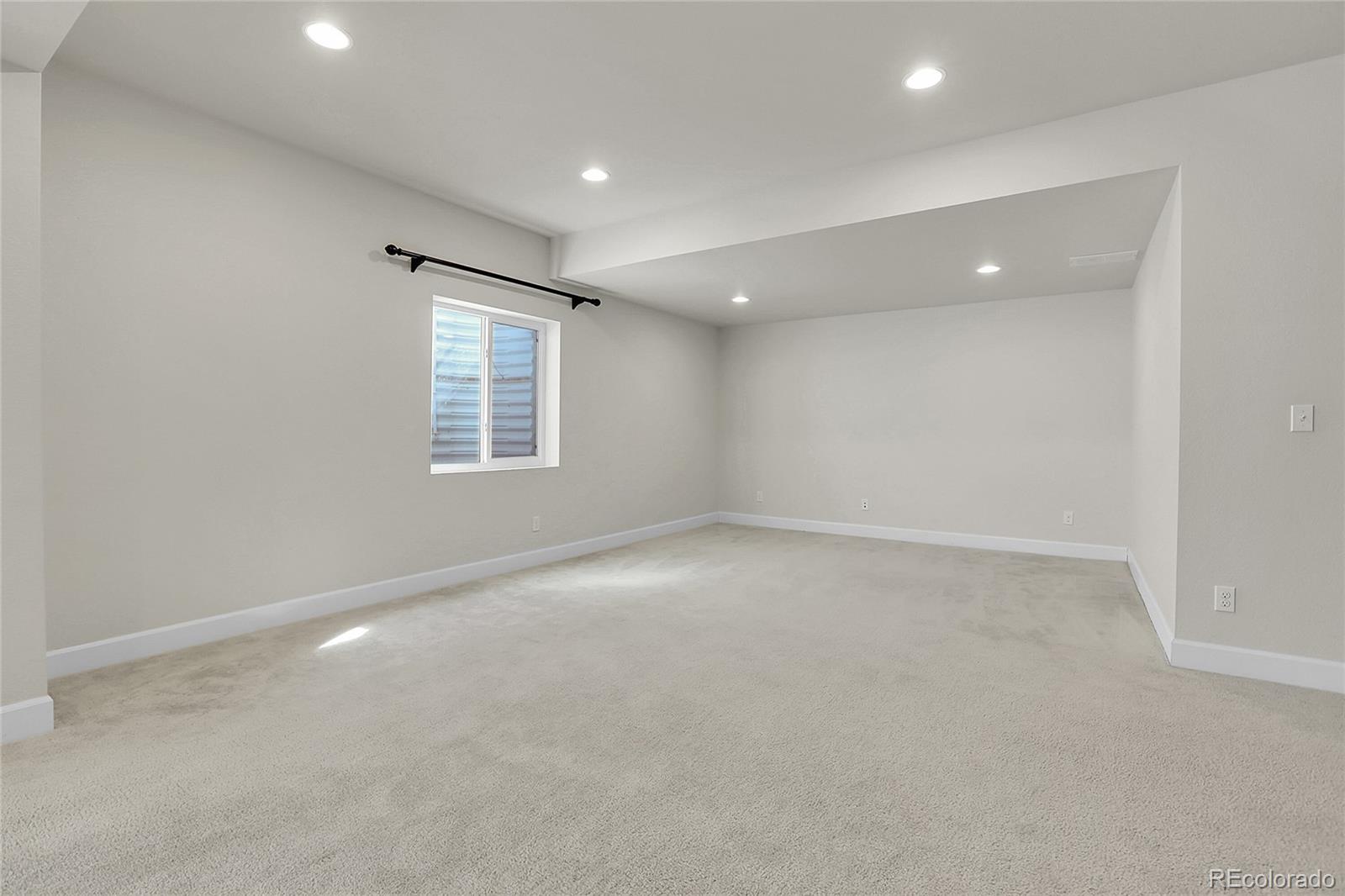 3310 Quicksilver Road Frederick, CO 80516 - Photo 25 of 35 an empty room with windows and closet